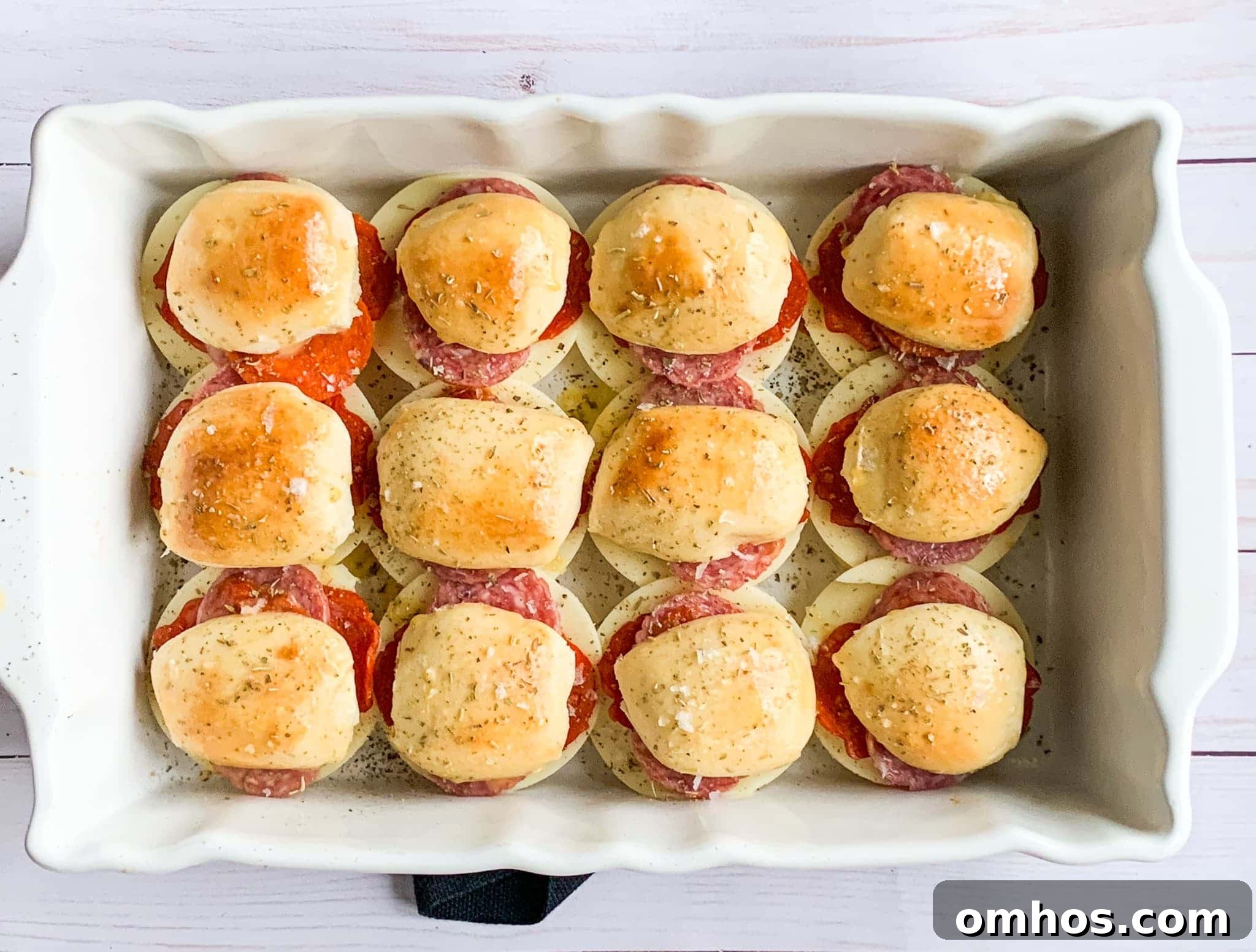 baked Super Bowl sliders filled with deli meats and cheese