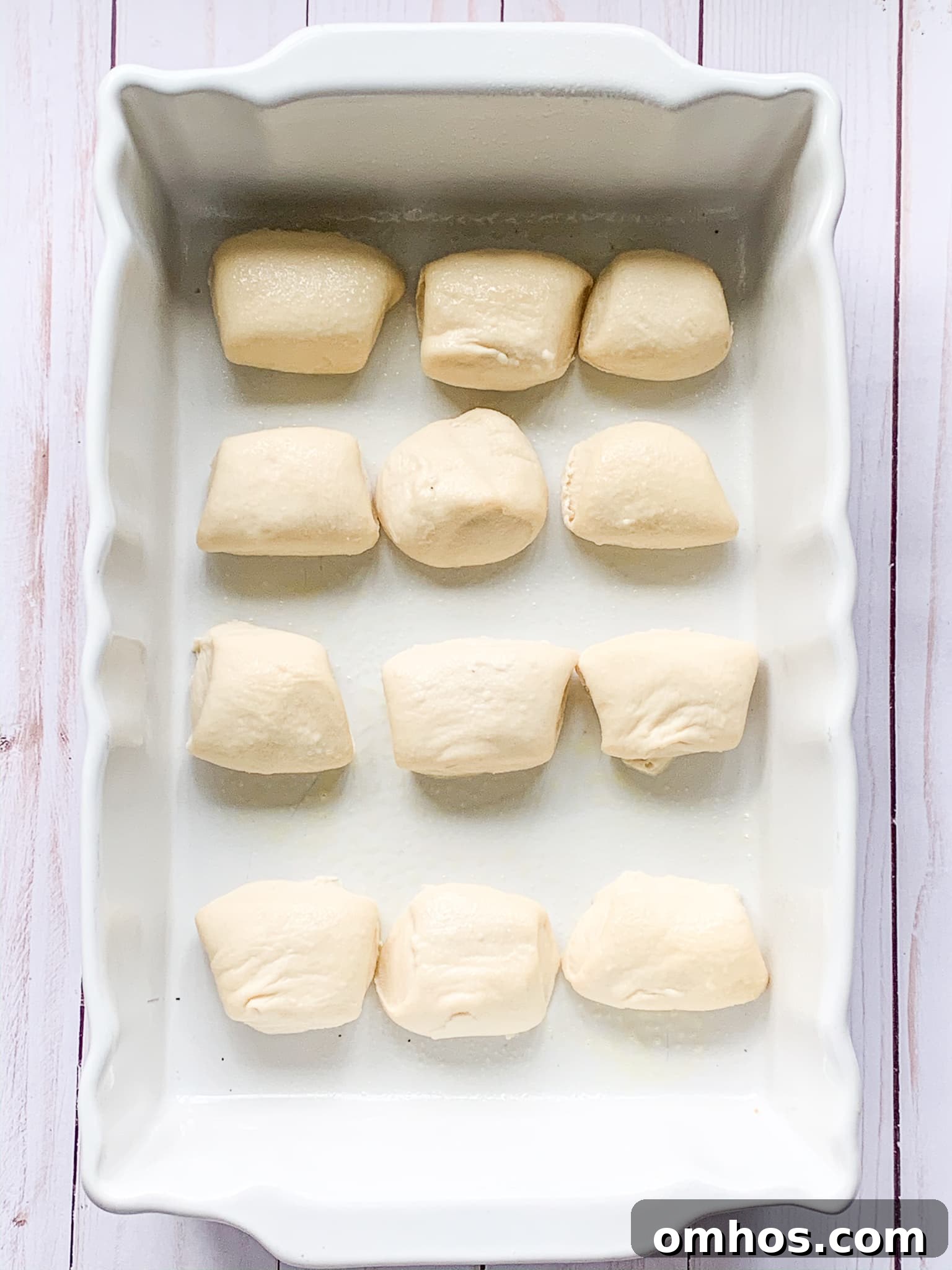 frozen dough for Super Bowl sliders in a baking dish.