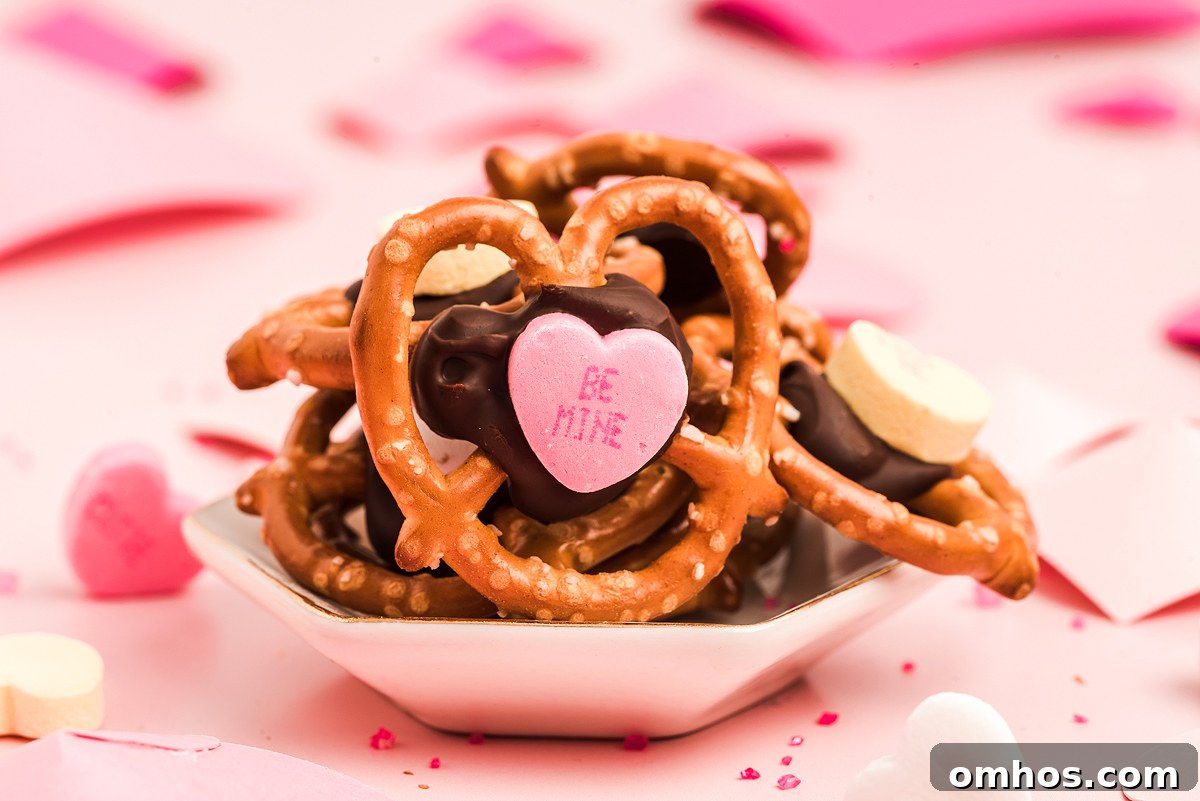 Valentine Pretzel Snack Bites Recipe 2 Valentine's Day pretzels on a pink background. Valentine pretzels.