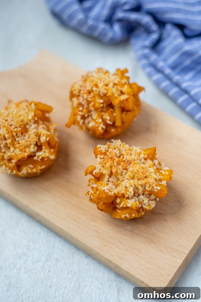 Macaroni and Cheese Muffins Macaroni and Cheese Muffins on wooden cutting board.