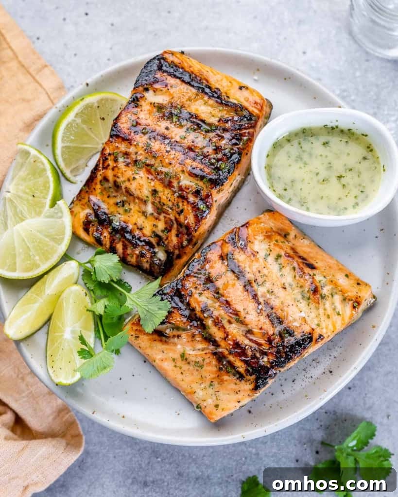 side shot of salmon filets on a white plate