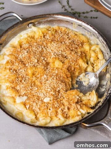 Gouda mac and cheese in a skillet fresh out of the oven.
