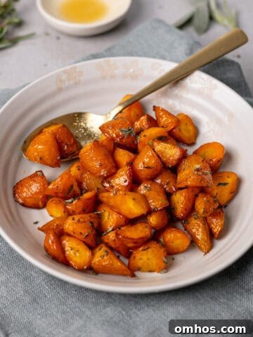 A close up of a bowl with air fryer honey roasted carrots.