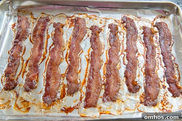 Classic Cobb Salad with Bacon, Avocado and Blue Cheese 4 Oven Roasted Bacon Strips on a Sheet Pan