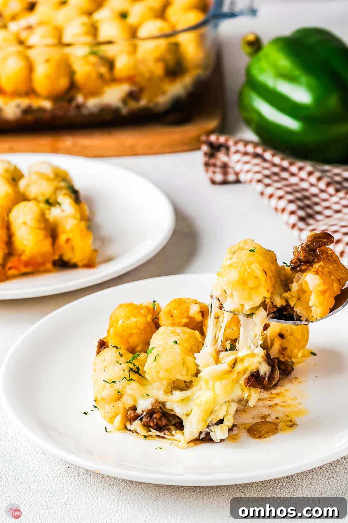 fork with bite of philly cheesesteak casserole