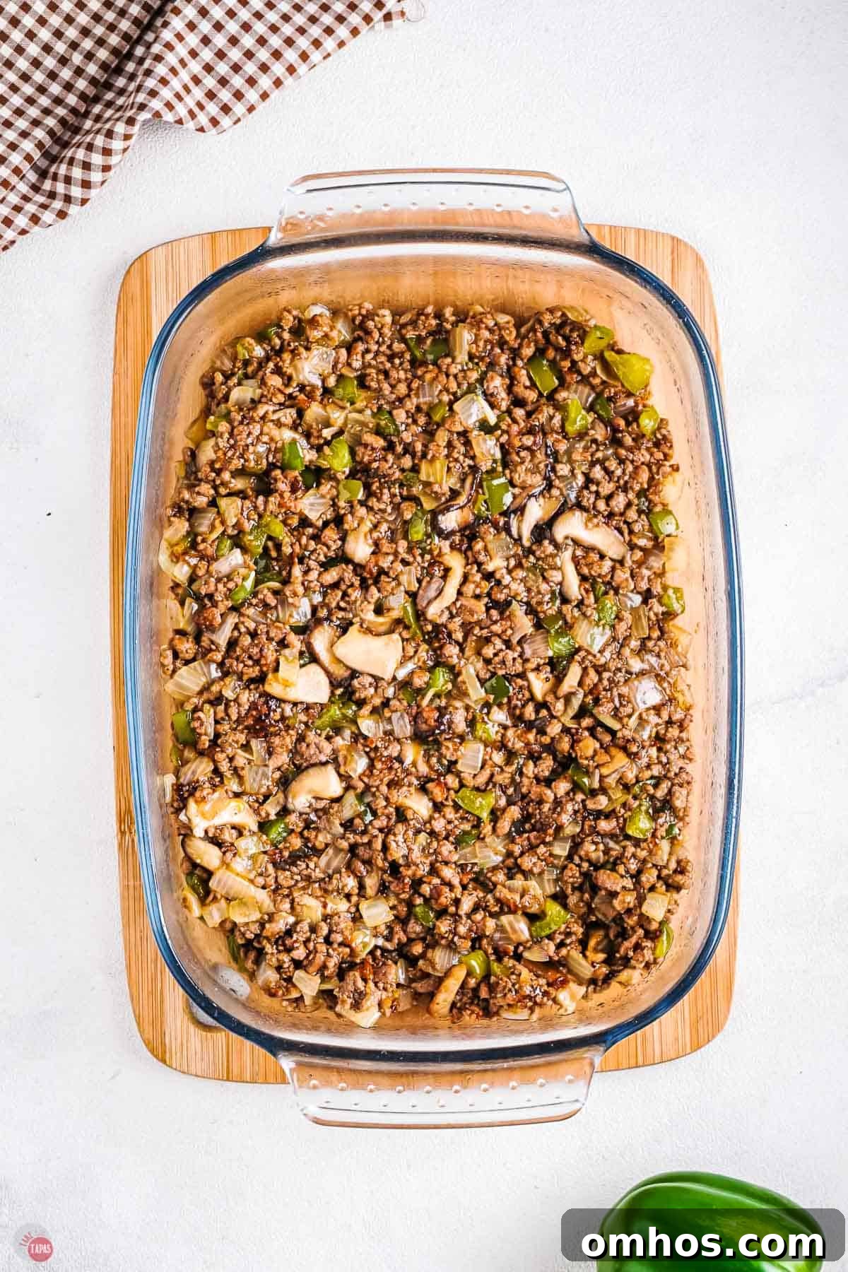 philly cheesesteak filling in a casserole dish
