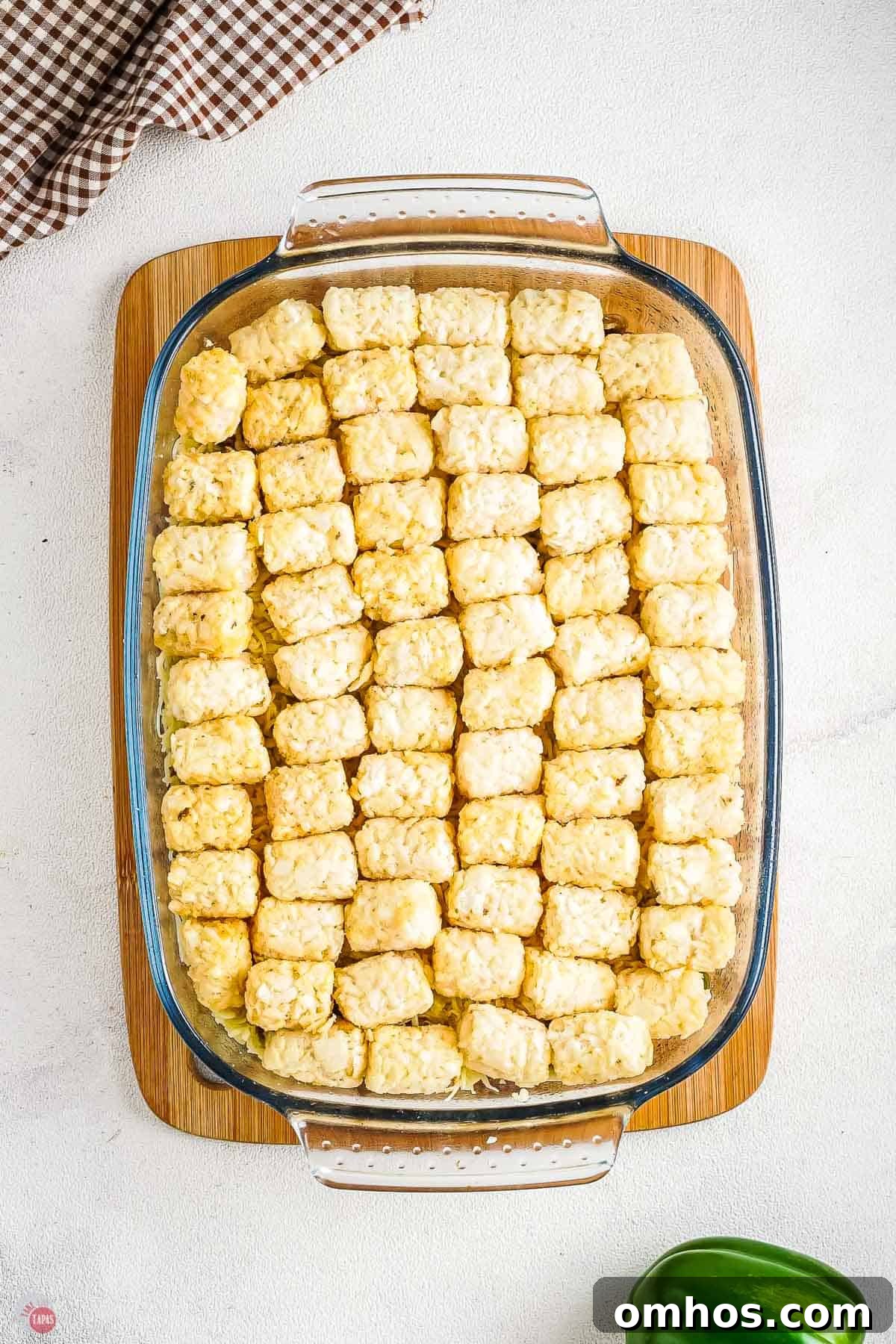 casserole dish filled with frozen tater tots