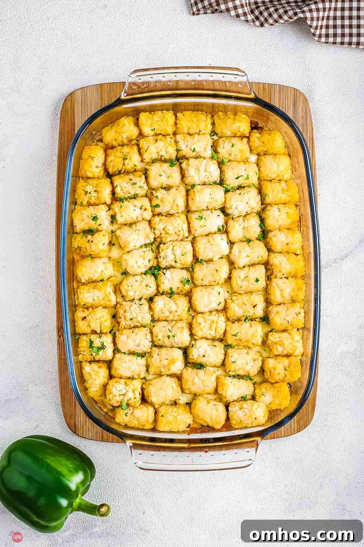 baking dish with cooked tater tot casserole in it