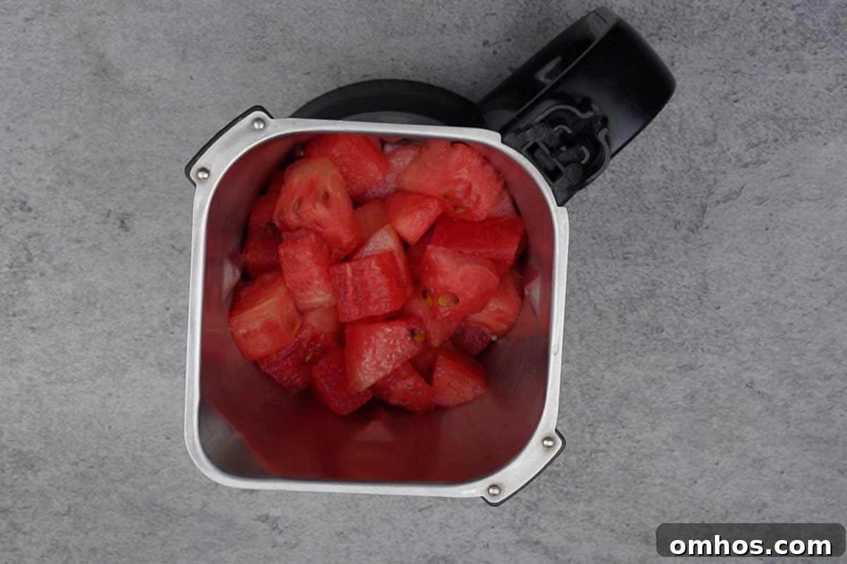 Refreshing Watermelon Mint Mojito Cocktail 3 Watermelon cubes added to a blender.