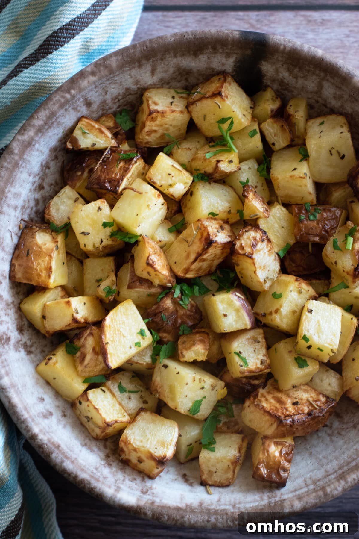 Crispy Air Fryer Rutabaga Fries 4 Top view of a bowl filled with roasted rutabagas.