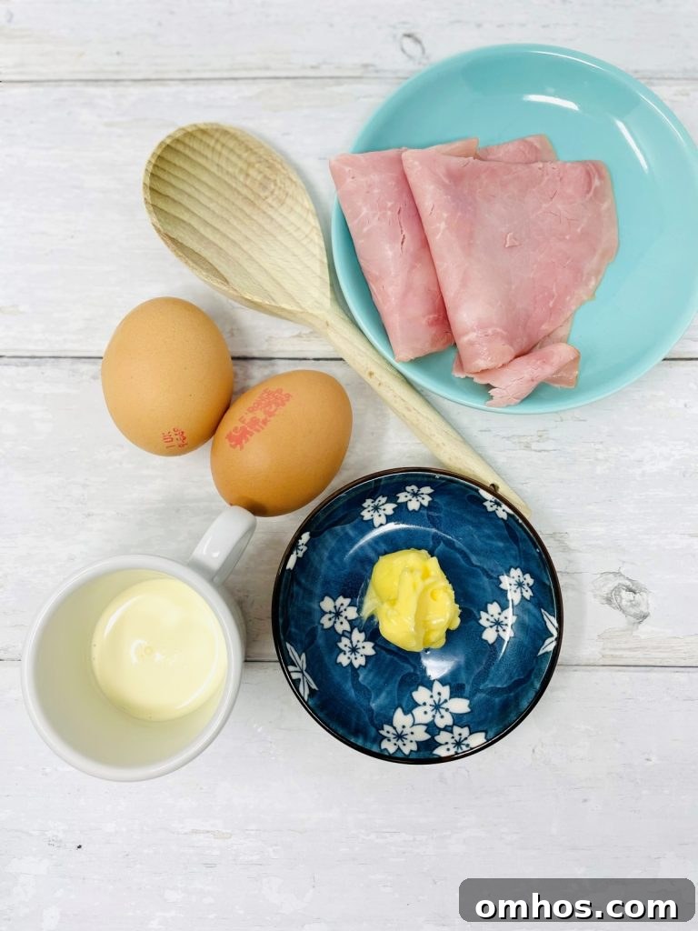 Ingredients needed for scrambled eggs with ham: ham slices, eggs, milk, butter