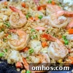 Blackstone shrimp fried rice cooking on the hot griddle.
