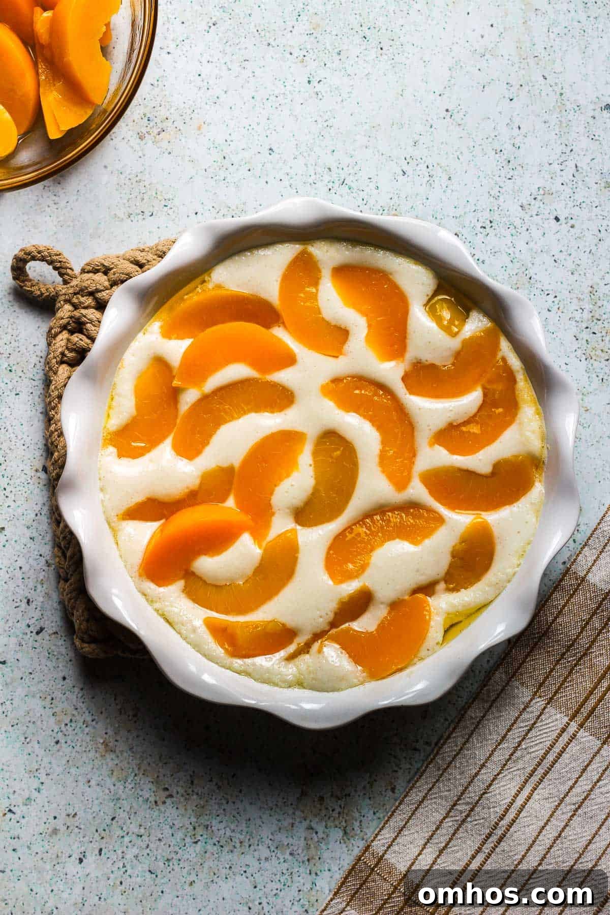 Classic Southern Peach Cobbler Recipe 4 unbaked peach cobbler in a baking dish