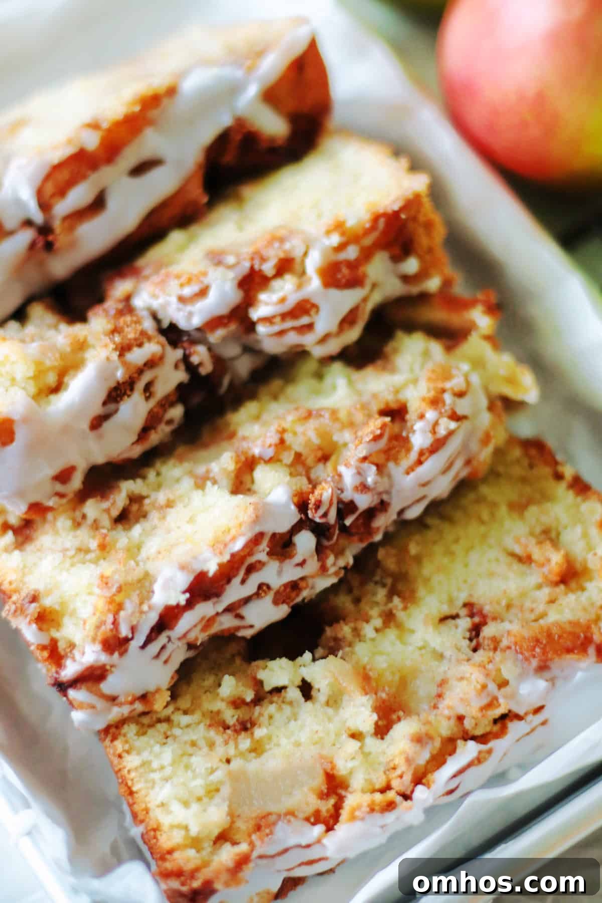 Homemade Apple Fritter Bread with Cinnamon Glaze 12 4 slices of apple fritter bread on a platter.