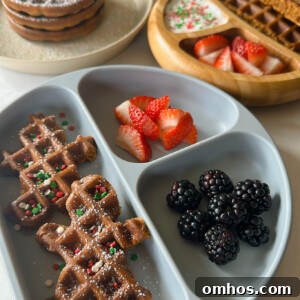 Gingerbread waffles served with yogurt, strawberries and blackberries.