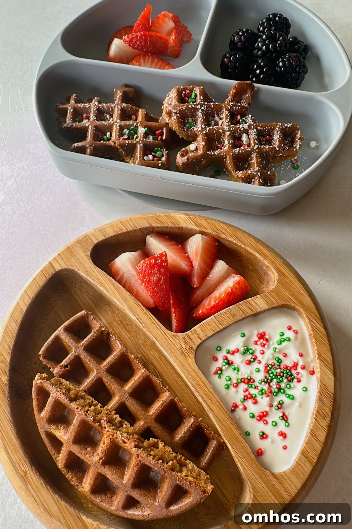 Gingerbread waffles served with yogurt and strawberries.