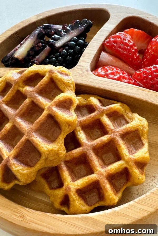 Sweet potato waffles served with strawberries and blackberries.