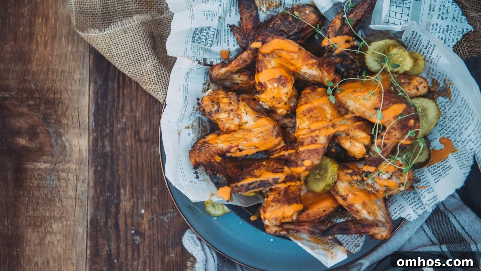 Air fryer pickle brined wings crisped with seasoning on golden skin.