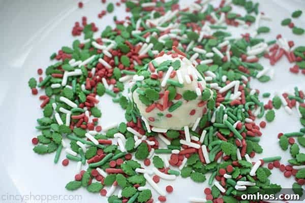 Cake-Mix Christmas Cookies Recipe 8 Rolling cookie dough in sprinkles for Christmas