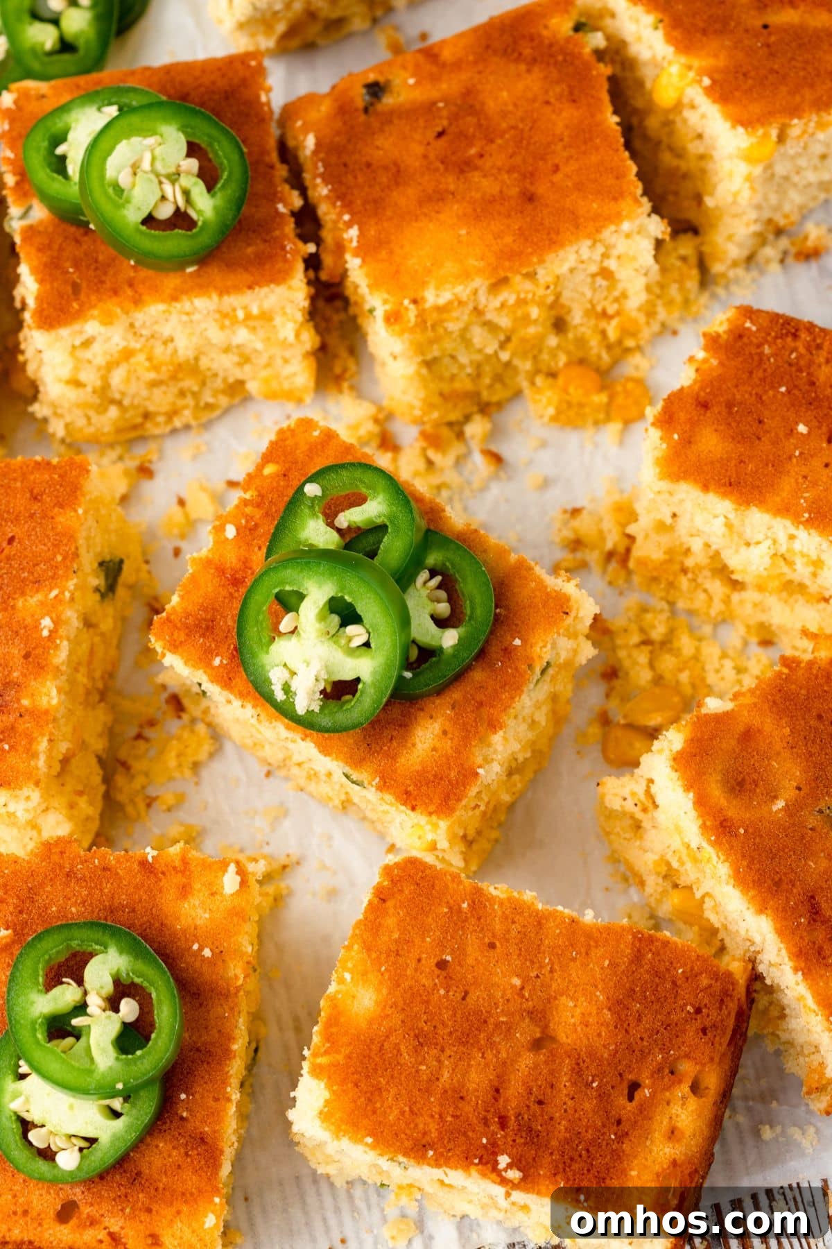 Skillet Jalapeño Cornbread Recipe 2 Squares of Jalapeño cornbread are topped with slices of fresh green jalapeños.