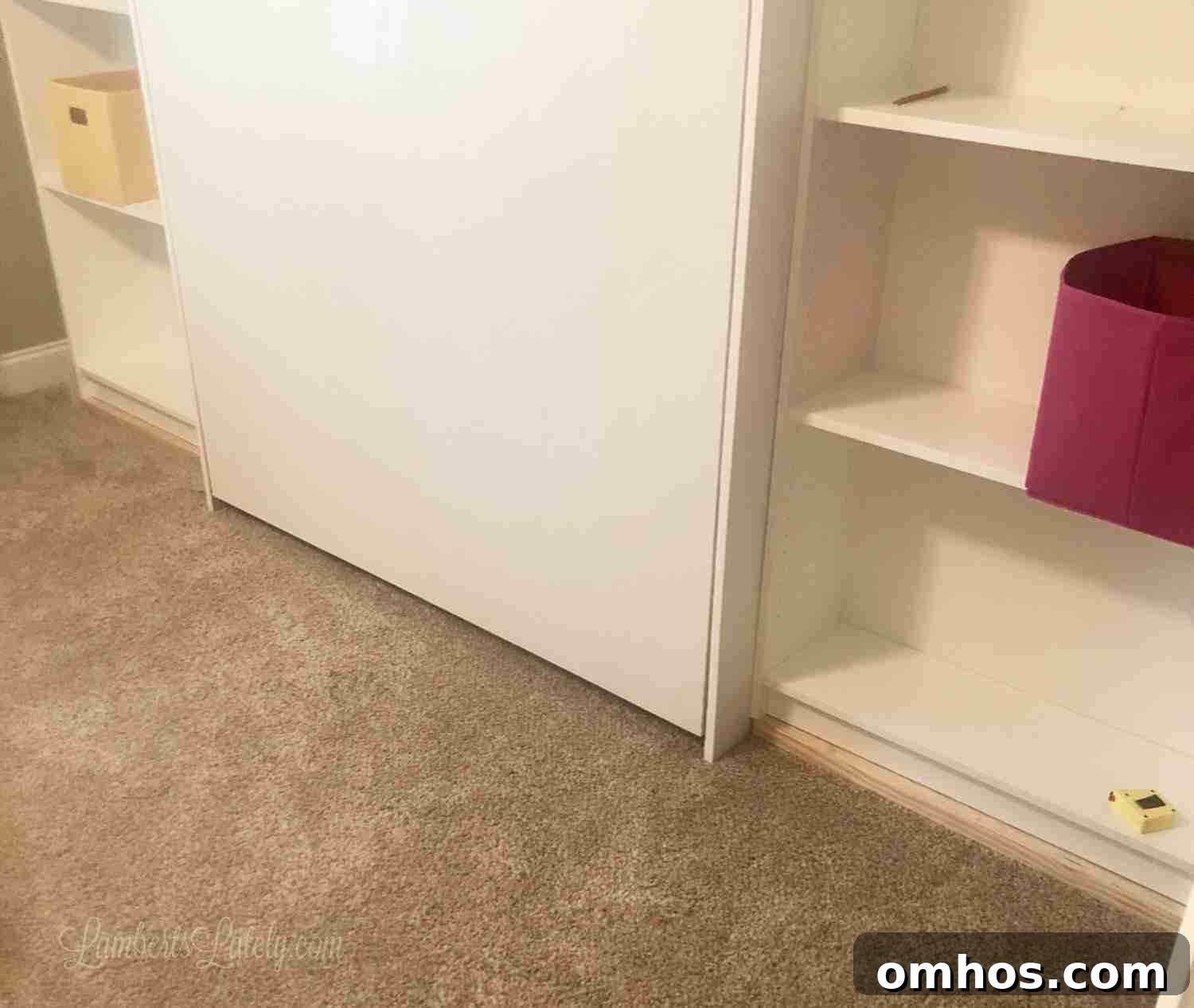 DIY Murphy Bed with Built-In Desk and IKEA Bookcases 11 bottom of murphy bed and shelves before installing baseboards.