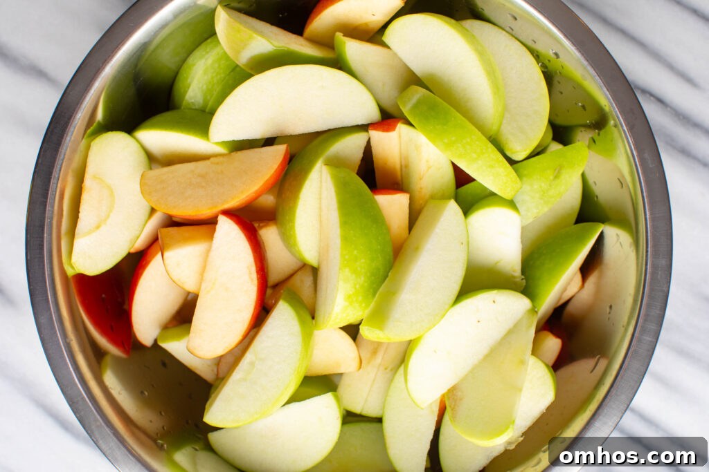 No-Peel Instant Pot Apple Butter Recipe 3 large mixing bowl filled with sliced red and green apples