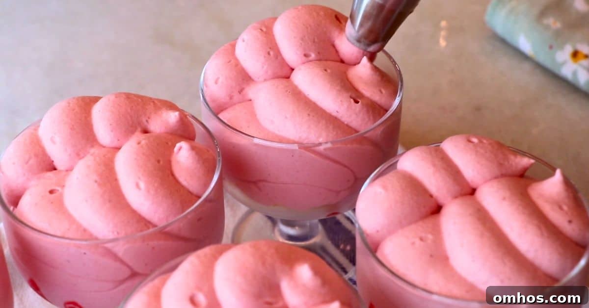 Creamy Raspberry Mousse Recipe: No-Bake Dessert 9 Piping raspberry mousse into cups