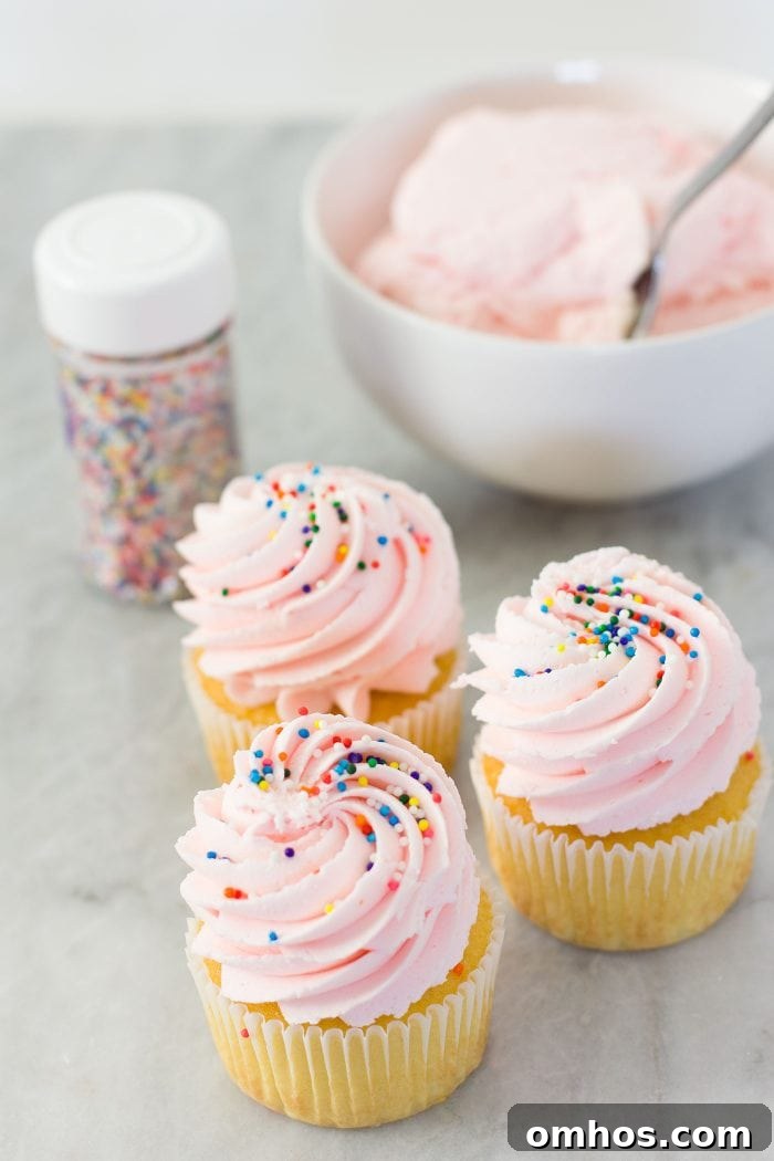 Homemade Cotton Candy Frosting Recipe for Cakes and Cupcakes 2 Pink cotton candy frosting on cupcakes