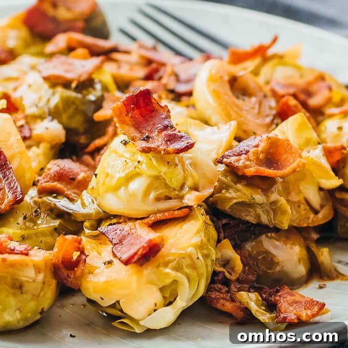 25 Quick Instant Pot Side Dish Recipes for Weeknights 16 Brussels Sprouts cooked in an instant Pot topped with bacon, fork on side.