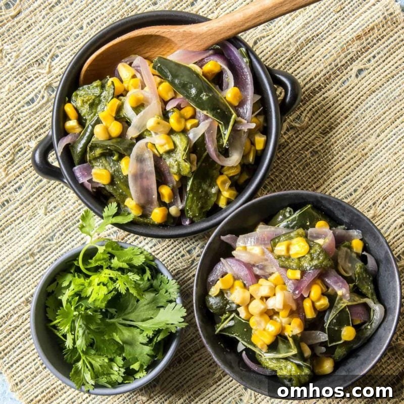 25 Quick Instant Pot Side Dish Recipes for Weeknights 21 Rajas Con Crema in black bowls containing poblano peppers, onions, and corn finished with a little crème fraîche.