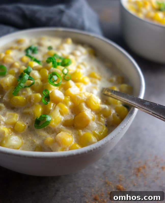 25 Quick Instant Pot Side Dish Recipes for Weeknights 5 Bowl containing Spicy Creamed Corn made in Instant Pot, topped with scallions.