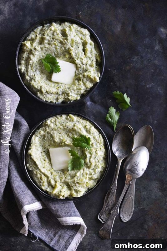 25 Quick Instant Pot Side Dish Recipes for Weeknights 8 2 black bowls containing a Creamy Garlic Broccoli Mash made in an instant Pot, topped with butter and cilantro.