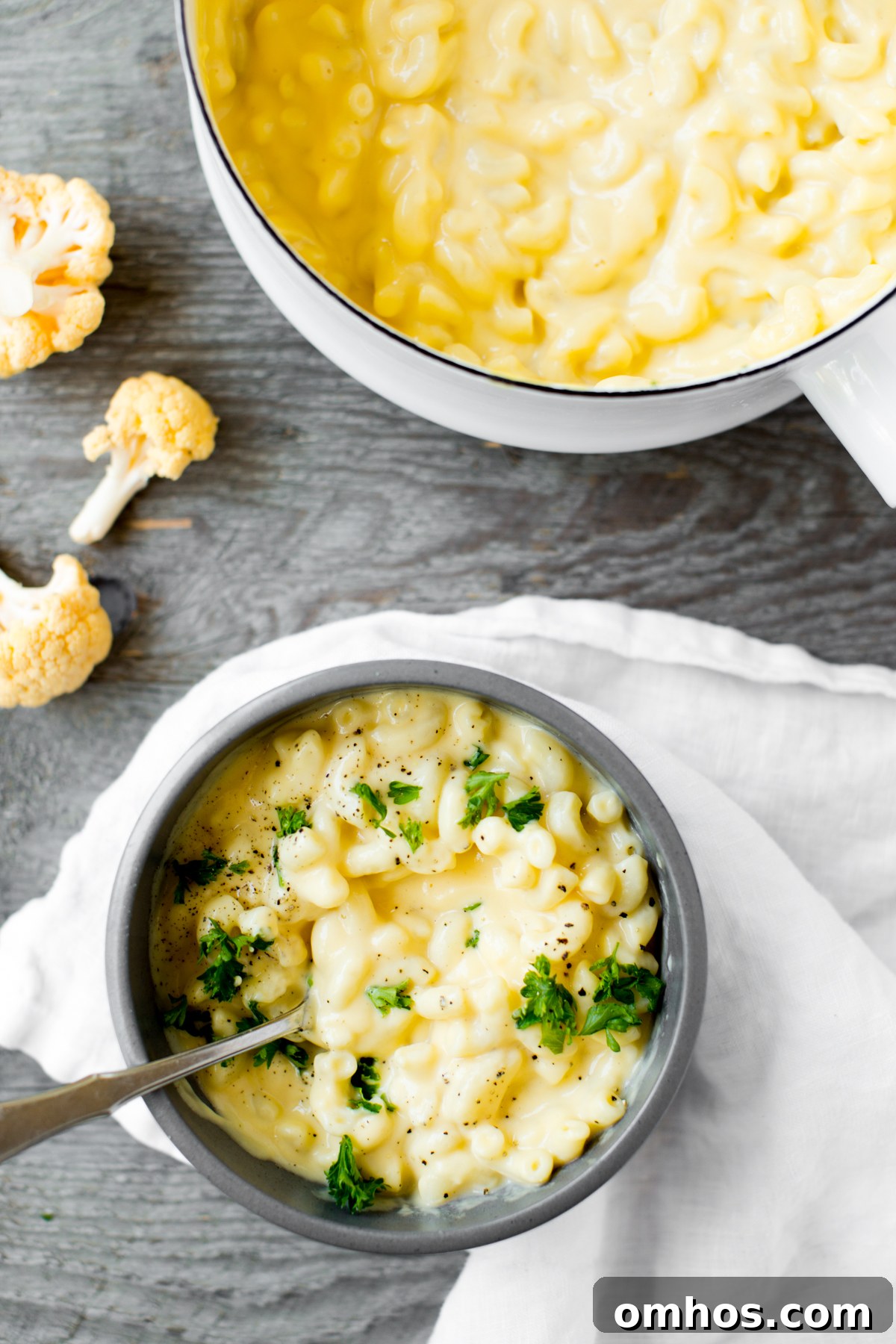 closeup of bowl of cauliflower mac and cheese with parsley