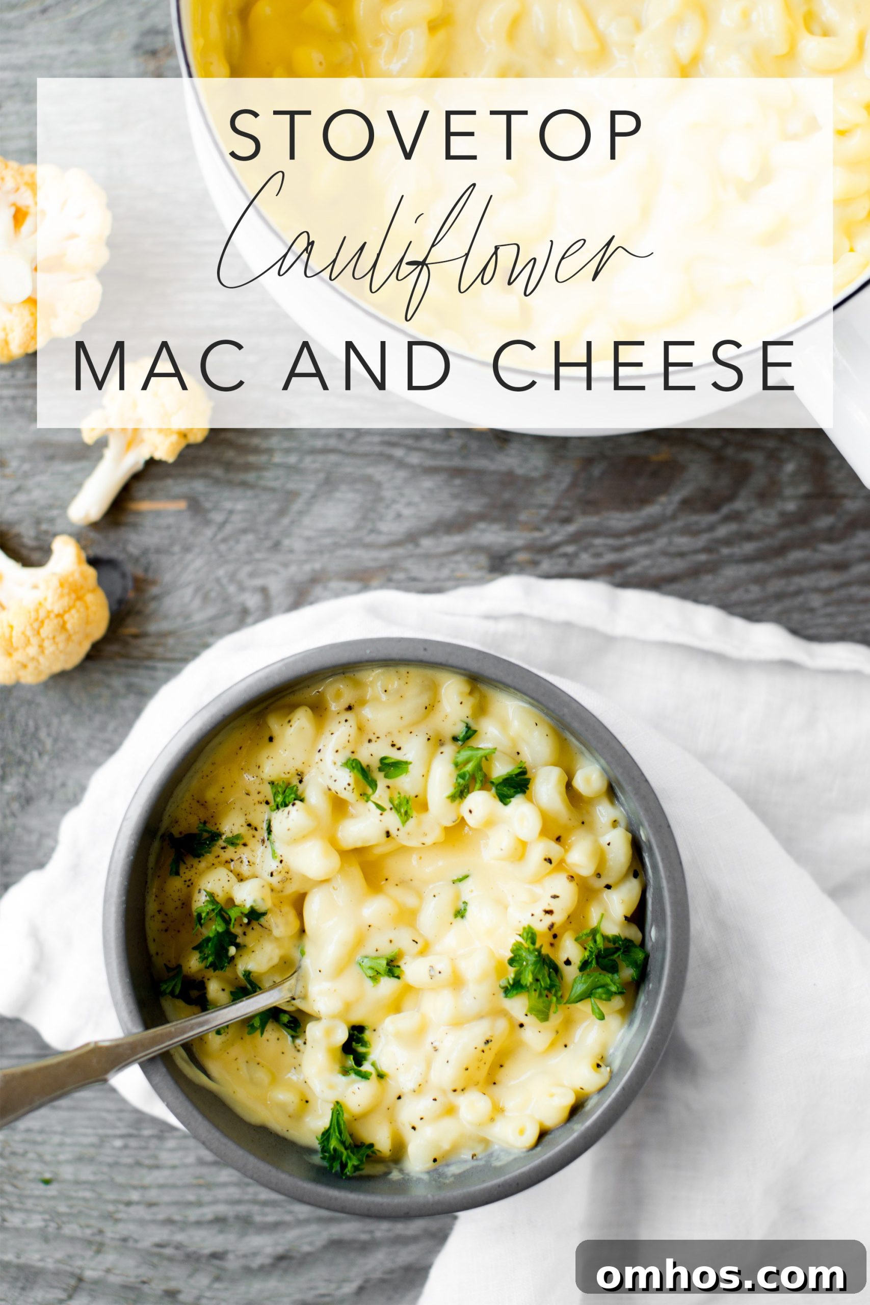 stovetop cauliflower mac and cheese in a bowl with a gray background and text overlay