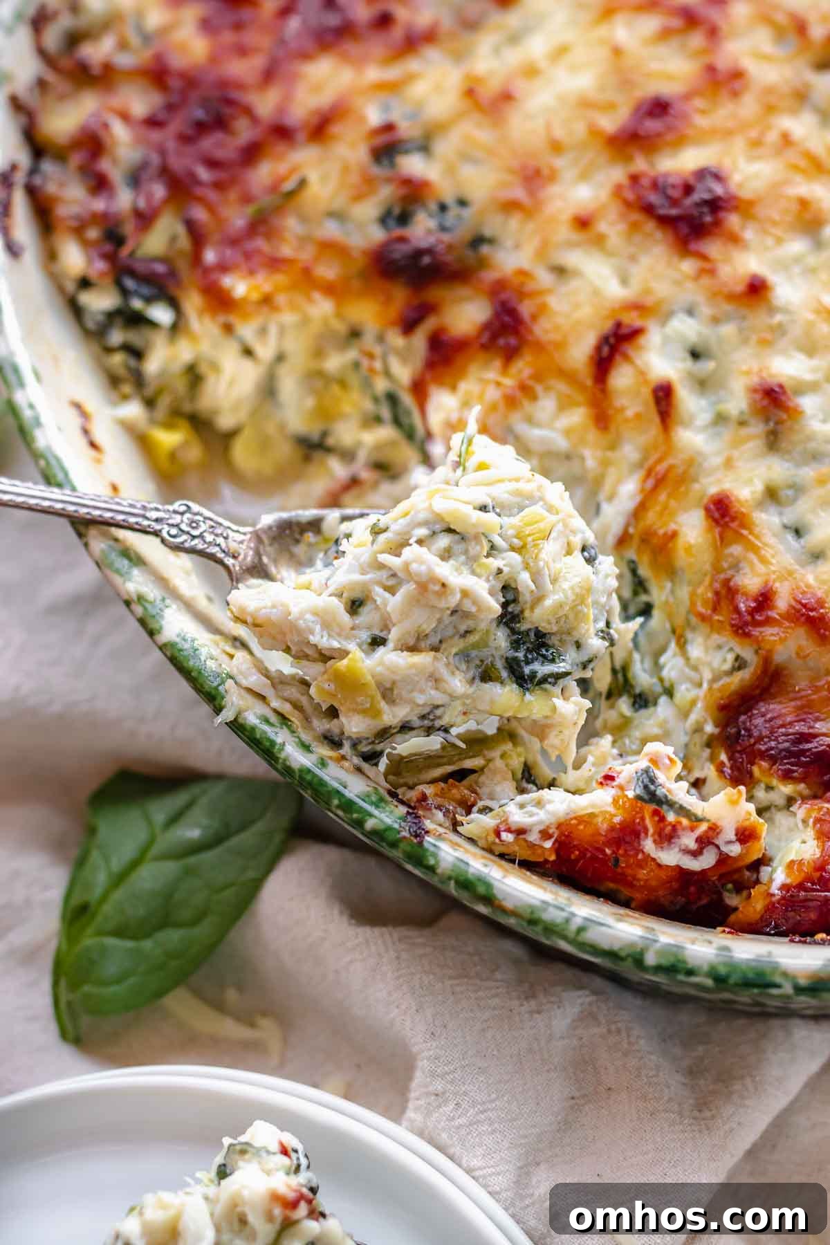 A spoonful of hot crab spinach artichoke dip.