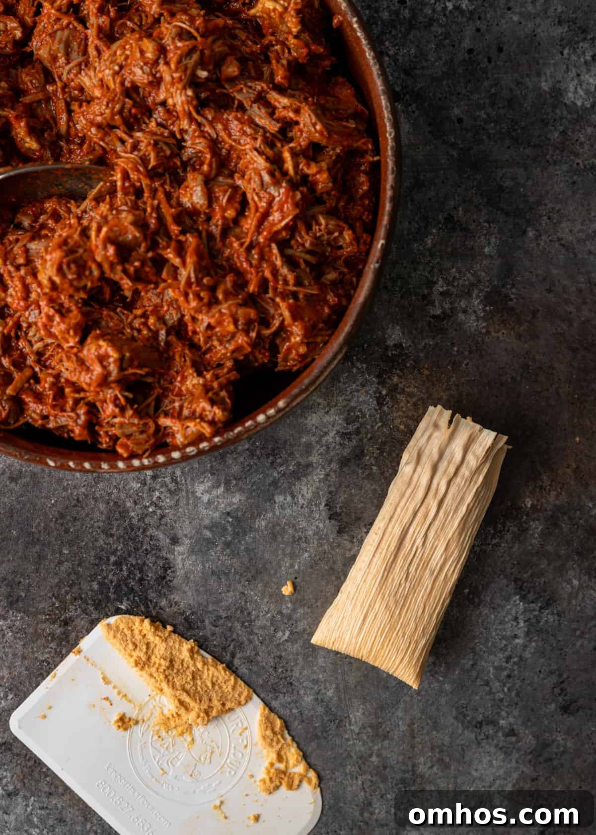Authentic Mexican Red Pork Tamales Recipe 13 overhead process shot: titled image (and shown) ready to steam