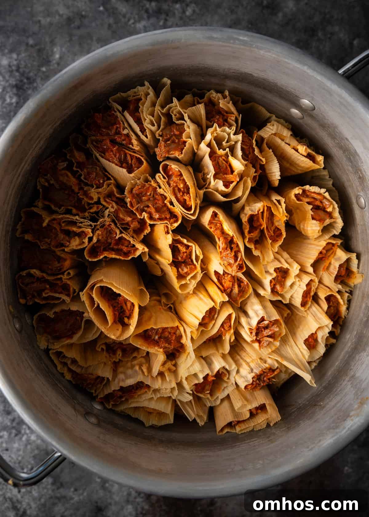 Authentic Mexican Red Pork Tamales Recipe 17 overhead: tamales in a steamer